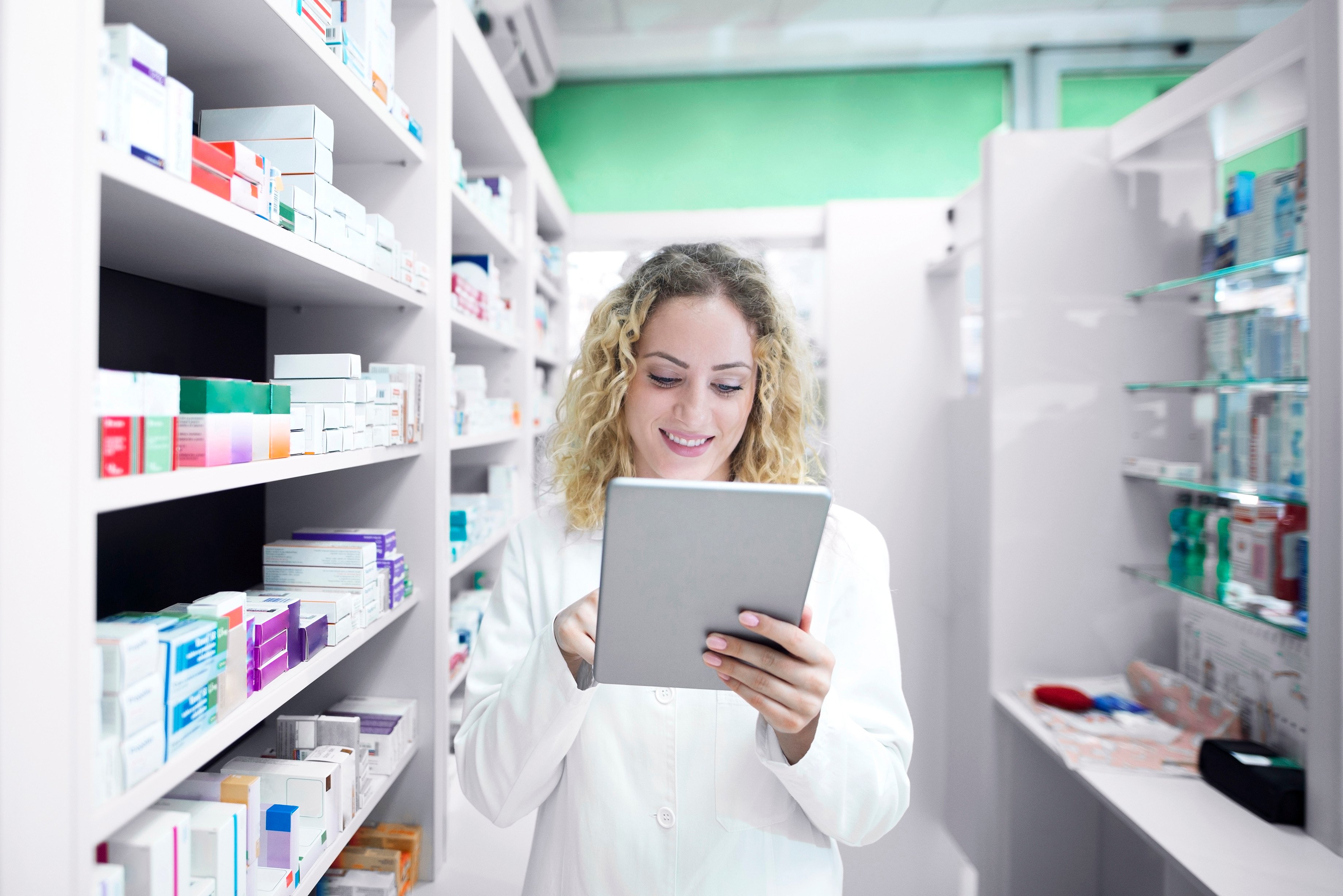 Pharmacist in a pharmacy doing inventory