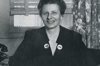 Dr. Katherine Gillette Blyley sitting behind a desk